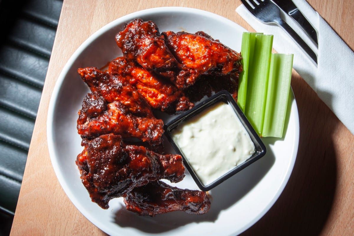 Crispy chicken wings with celery and blue cheese at DeWolf Brewing Company