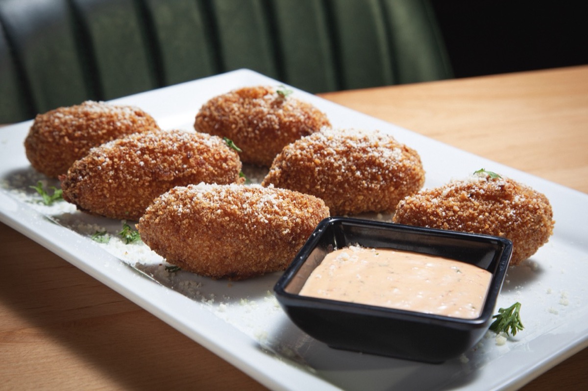 Golden fried croquettes with roasted garlic aioli at DeWolf Brewing Company