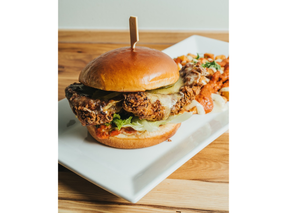 Fried chicken sandwich with romesco and roasted red pepper aioli