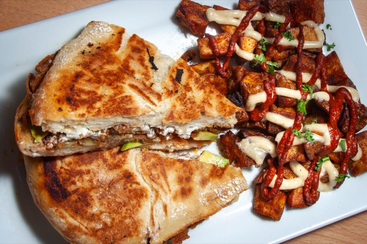 Garden Melt with crispy eggplant, romesco, goat cheese and avocado
