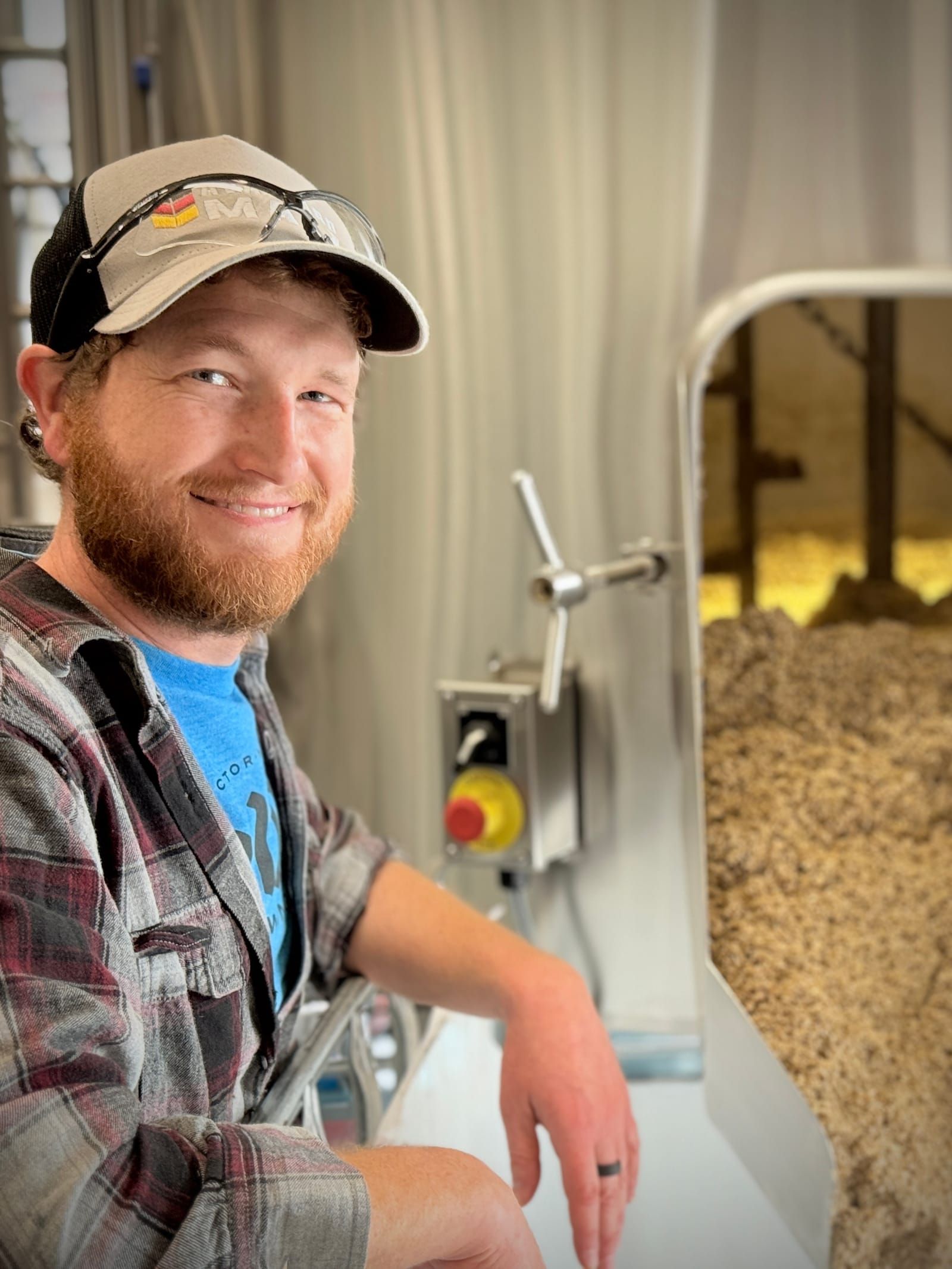 Zack Haggerty, Head Brewer at DeWolf Brewing, beside the mash tun